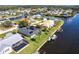 Aerial view of waterfront homes with boat docks and waterway access in a quiet neighborhood at 19179 Aviation Ct, Port Charlotte, FL 33948