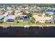 A high-angle view of a home with a private pool and canal access at 19179 Aviation Ct, Port Charlotte, FL 33948