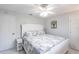 Bedroom with ceiling fan, white walls and white bedspread at 19179 Aviation Ct, Port Charlotte, FL 33948