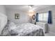 Bedroom featuring a ceiling fan and window at 19179 Aviation Ct, Port Charlotte, FL 33948