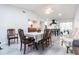 Elegant dining area that connects to the kitchen, and offers seating for eight, bathed in natural light at 19179 Aviation Ct, Port Charlotte, FL 33948