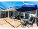 Outdoor patio with dining table, BBQ and seating area at 19179 Aviation Ct, Port Charlotte, FL 33948