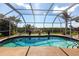 Sparkling enclosed pool with a lovely water view at 19179 Aviation Ct, Port Charlotte, FL 33948