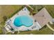 Bird's eye view of the pool and surrounding landscaping and relaxing areas at 1999 Kings Hwy # 21A, Punta Gorda, FL 33980