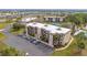 Aerial view of the complex showcases landscaped grounds, parking, and building design at 1999 Kings Hwy # 21A, Punta Gorda, FL 33980