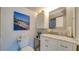 Well-lit bathroom featuring a modern vanity, updated fixtures, and serene décor for a spa-like experience at 1999 Kings Hwy # 21A, Punta Gorda, FL 33980