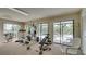 Well-equipped gym with a variety of fitness machines and a view of the pool at 1999 Kings Hwy # 21A, Punta Gorda, FL 33980