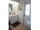 Bathroom with white vanity and modern fixtures at 223 Valdiva St, Punta Gorda, FL 33983