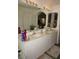 Double vanity bathroom with arch-mirror and columns at 223 Valdiva St, Punta Gorda, FL 33983