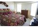 Bright bedroom featuring a floral comforter and natural light at 223 Valdiva St, Punta Gorda, FL 33983