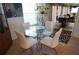 Dining area featuring a glass table, modern seating, and bold zebra-themed decor at 223 Valdiva St, Punta Gorda, FL 33983