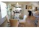 Open-concept dining area with a glass table and white chairs, leading into a spacious living area at 223 Valdiva St, Punta Gorda, FL 33983