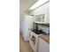 View of kitchen featuring white cabinets, granite counters, and stainless steel appliances at 223 Valdiva St, Punta Gorda, FL 33983