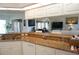 Kitchen view showcasing granite counters, white cabinets, and an open layout to living area at 223 Valdiva St, Punta Gorda, FL 33983