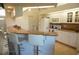 Well-lit kitchen with a marble countertop bar and ample cabinet space at 223 Valdiva St, Punta Gorda, FL 33983