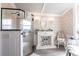 Bright bathroom showcasing a glass enclosed shower, decorative fireplace, and elegant finishes at 23144 Donalda Ave, Port Charlotte, FL 33954