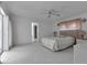 Bright bedroom featuring neutral colors, ceiling fan, and sliding door access at 23411 Superior Ave, Port Charlotte, FL 33954