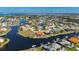 Aerial shot of canal-front home with boat lift, offering easy water access and stunning neighborhood views at 237 Freeport Ct, Punta Gorda, FL 33950