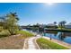 Waterfront backyard with a dock, seating and easy access to canal waters at 237 Freeport Ct, Punta Gorda, FL 33950