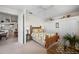 Airy bedroom with closet storage, glass table, and floral bedding at 237 Freeport Ct, Punta Gorda, FL 33950