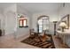 Dining area features an arched window, tiled floors, and an elegant table setting at 237 Freeport Ct, Punta Gorda, FL 33950