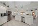 Bright kitchen featuring stainless steel appliances, white cabinetry, and an open floor plan at 237 Freeport Ct, Punta Gorda, FL 33950