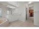 Well-lit main bathroom featuring a large mirror and a vanity with white cabinetry at 237 Freeport Ct, Punta Gorda, FL 33950