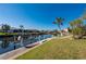 Scenic waterfront view highlighting a private boat dock and lift at 237 Freeport Ct, Punta Gorda, FL 33950