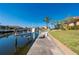 This backyard has a view of the waterfront featuring a private boat dock at 237 Freeport Ct, Punta Gorda, FL 33950