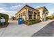 Exterior of clubhouse with parking for golf carts and covered patio at 25197 Keygrass Ct, Punta Gorda, FL 33955