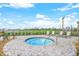 Community hot tub overlooking golf course with lounge chairs at 25197 Keygrass Ct, Punta Gorda, FL 33955