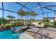 Lovely screened pool with spa and lounge seating, offering a private and serene backyard retreat at 25197 Keygrass Ct, Punta Gorda, FL 33955