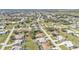 Detailed aerial shot of a community, exhibiting streets, homes, and verdant landscaping at 27566 Tierra Del Fuego Cir, Punta Gorda, FL 33983