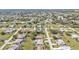 Elevated aerial image of a neighborhood showcasing homes, streets, and greenbelts at 27566 Tierra Del Fuego Cir, Punta Gorda, FL 33983