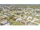 Extensive aerial view of a planned community showcasing homes, roads, and natural features at 27566 Tierra Del Fuego Cir, Punta Gorda, FL 33983