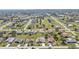 Expansive aerial view of a residential neighborhood showcasing well-maintained homes and green spaces at 27566 Tierra Del Fuego Cir, Punta Gorda, FL 33983