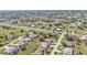 Overhead aerial photo of a residential area featuring spacious lots and mature trees at 27566 Tierra Del Fuego Cir, Punta Gorda, FL 33983