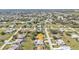 Aerial view of a home with a private pool in a lush residential neighborhood at 27566 Tierra Del Fuego Cir, Punta Gorda, FL 33983