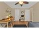 Bedroom area with a wooden desk, two closets, and a ceiling fan at 27566 Tierra Del Fuego Cir, Punta Gorda, FL 33983