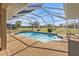 Screened-in pool with clear blue water and surrounding patio area at 27566 Tierra Del Fuego Cir, Punta Gorda, FL 33983