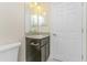 Bathroom with a dark vanity cabinet and granite counter top at 2851 Verde Ter, North Port, FL 34286