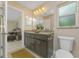 Bathroom featuring a double sink vanity with granite countertops and modern fixtures at 2851 Verde Ter, North Port, FL 34286