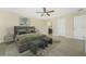 Bedroom featuring a neutral color palette, ceiling fan, and ensuite bathroom access at 2851 Verde Ter, North Port, FL 34286