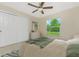 Bedroom with a large window overlooking the well manicured lawn at 2851 Verde Ter, North Port, FL 34286