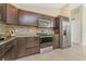 Chef's kitchen with granite countertops, stainless steel appliances, a breakfast bar, and tiled backsplash at 2851 Verde Ter, North Port, FL 34286