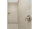 Tiled shower featuring a built in bench and wall niche at 2851 Verde Ter, North Port, FL 34286