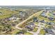 Community aerial showcasing the residential homes and tree-lined street in a scenic neighborhood near the water at 295 Porto Alegre St, Punta Gorda, FL 33983