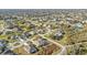 A captivating aerial view of a housing community featuring homes, landscaping, streets, and sidewalks at 295 Porto Alegre St, Punta Gorda, FL 33983