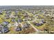 An amazing aerial view of an expansive residential community featuring a mix of home styles and landscaping at 295 Porto Alegre St, Punta Gorda, FL 33983