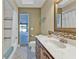 Bathroom featuring marble countertop and a large framed mirror at 295 Porto Alegre St, Punta Gorda, FL 33983